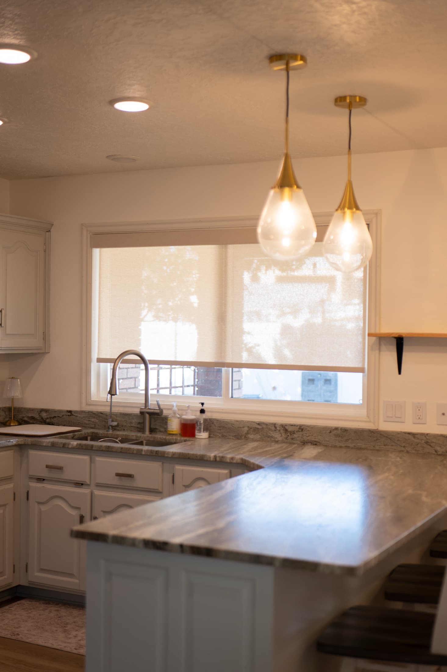 Modern motorized roller shades on large new-construction windows installed by Auto Blinds